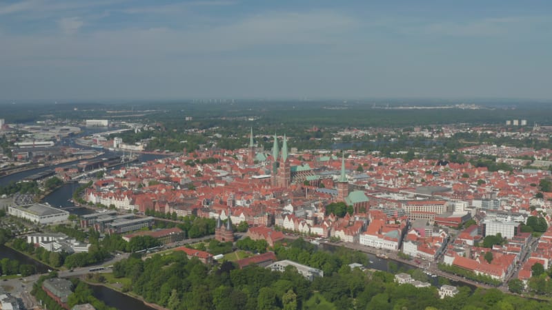 Aerial panoramic view of medieval city centre. Brick buildings in historic part of town in UNESCO world heritage site. Luebeck, Schleswig-Holstein, Germany