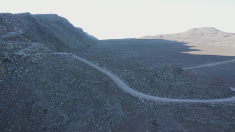 Aerial view of a vehicle driving a twisty road, Reunion.