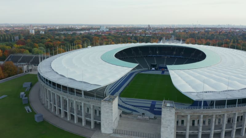 Majestic Olympia Stadium entrance with view of empty grandstand seating row with no people during Coronavirus Covid 19 Pandemic, Aerial Wide Establishing Shot, October 2020