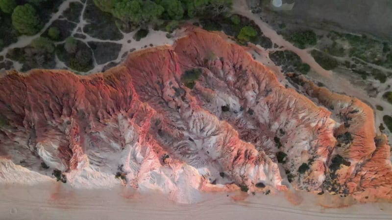 Aerial view of beautiful cliff formations in Praia do Falesia