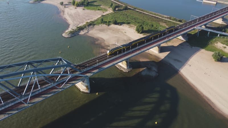 Train entering city using the Railway Bridge in Nijmegen, Gelderland province, the Netherlands.