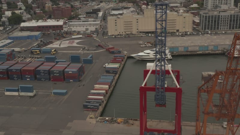 High angled view of industrial cranes in docks in New York City on cloudy day