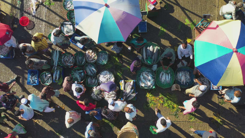 Aerial view of people at local fish market in Chittagong, Bangladesh.