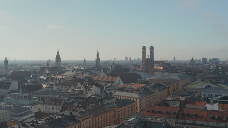 Scenic Aerial View over Munich, Germany Cityscape in Winter during the Coronavirus Covid 19 pandemic and Lockdown, Aerial Dolly right with View of Frauenkirche