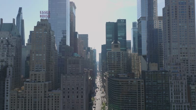 Ascending footage of majestic tall downtown skyscrapers in city. Modern high rise buildings with glass glossy facades. Manhattan, New York City, USA