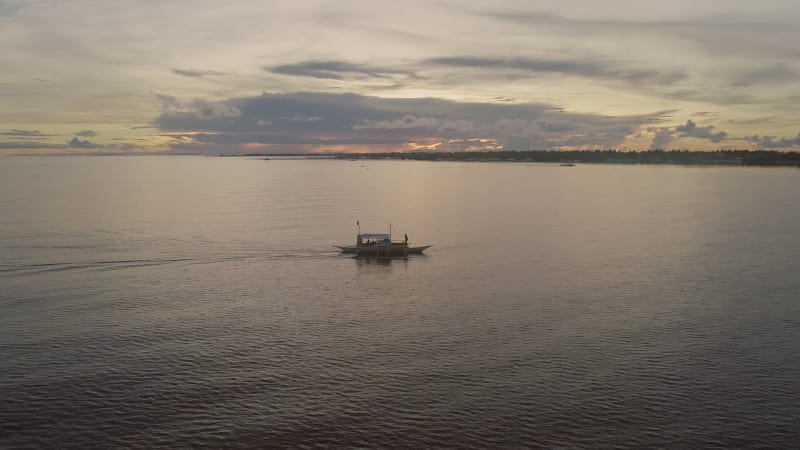 Aerial view of single filipino fishing boat near Lapu-Lapu city.