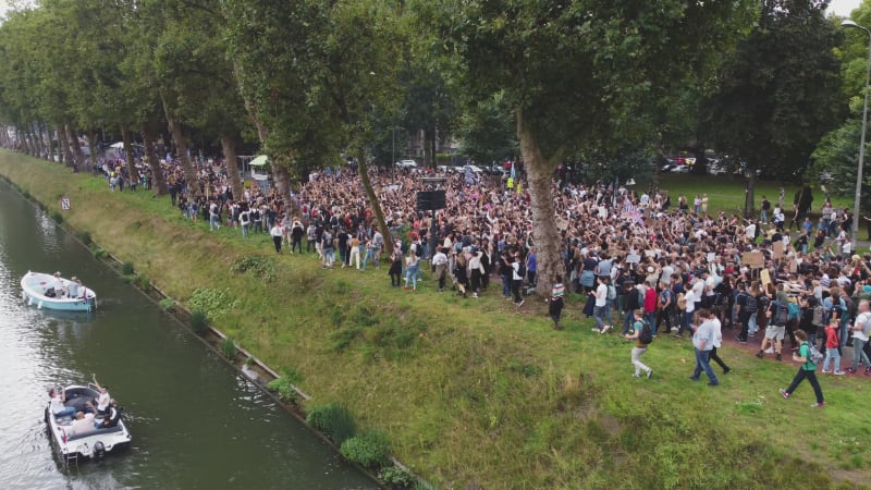 Protesters marching down a street during Unmute Us Campaign in Utrecht, Netherlands.