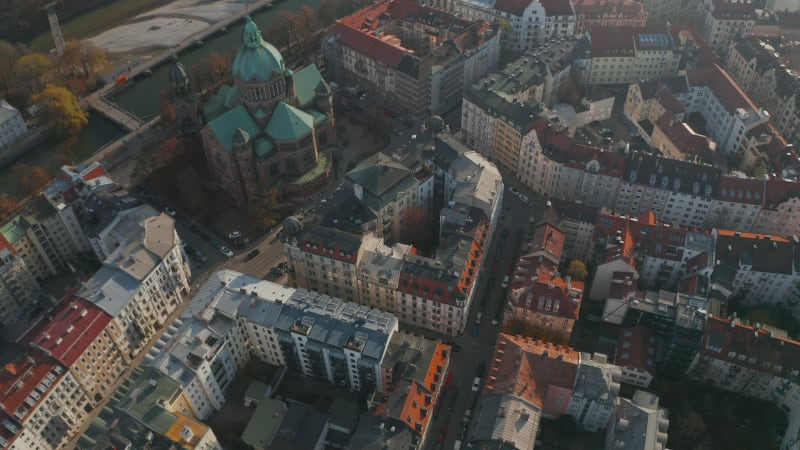 Tilt down Aerial Shot above typical Germany City Neighbourhood in Munich next to beautiful Cathedral and Isa River, Residential Streets, Aerial Birds Eye Overhead Top Down View