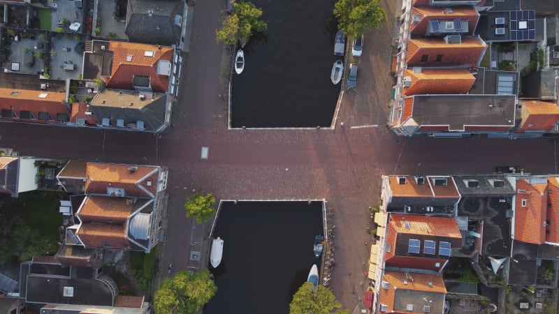 Bird's eye view of small bridge over a water canal in Alkmaar, North Holland Province, Netherlands.