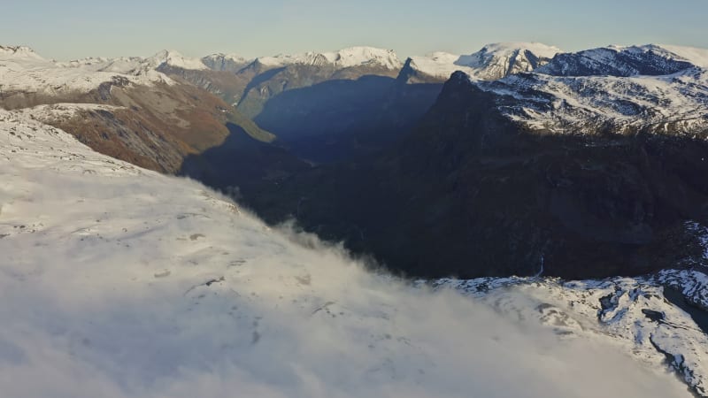 Misty and snowy view from Geiranger Skywalk in Norway.