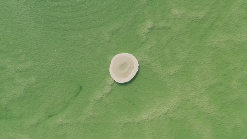 Aerial footage of Round shaped Salt deposit in the heart of the Dead Sea.