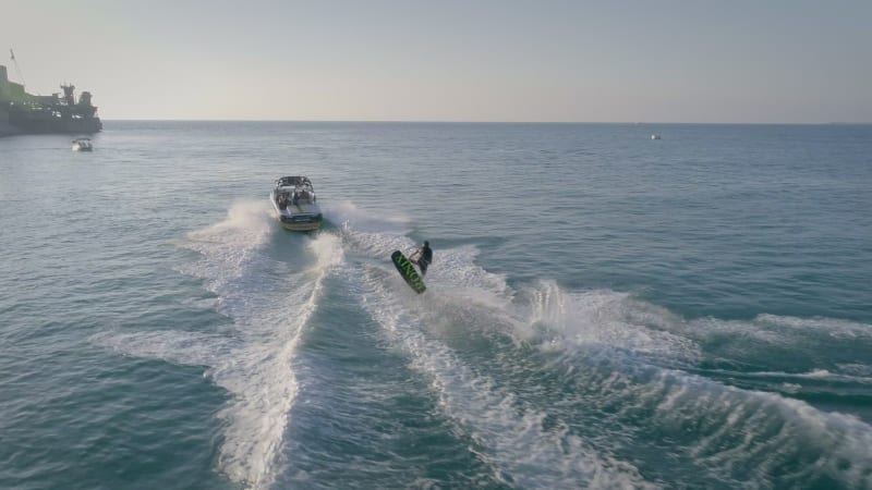 Aerial view of man doing water skiing in the mediterranean sea.