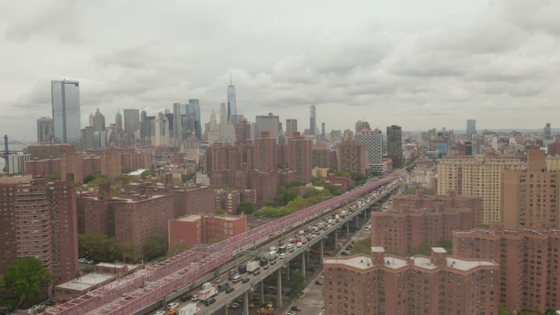 Flight over Williamsburg Bridge towards new World Trade Center at cloudy day