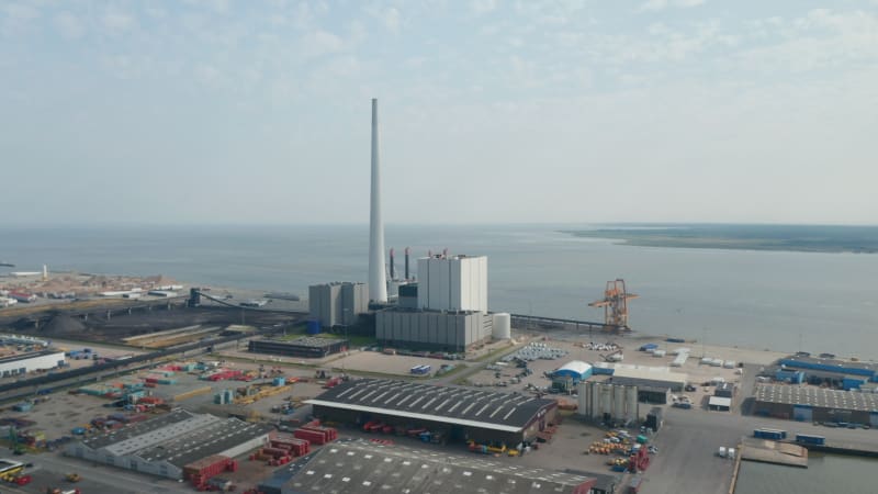 Panning aerial view over the power plant of Esbjerg, Denmark. The Steelcon power station chimney is the tallest in Scandinavia