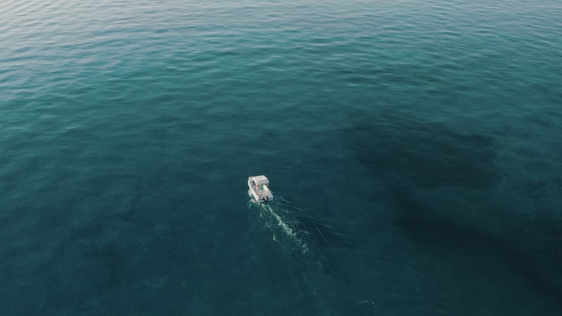 Aerial view of a speedboat in the Ionian Sea, Calabria, Italy.