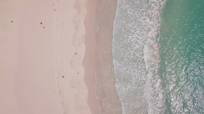 Shek O Beach, a white sandy stretch of sand in Hong Kong Island. Aerial drone top down view