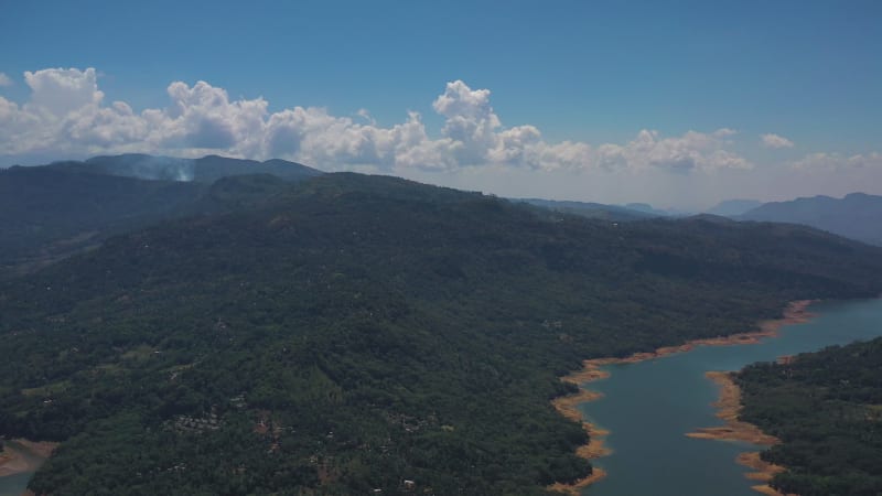 Aerial view of a river crossing the forest in Nuwara Eliya, Sri Lanka.