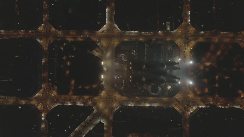 Barcelona Overhead Drone Shot of La Sagrada Familia at Night with Beautiful City Traffic lights