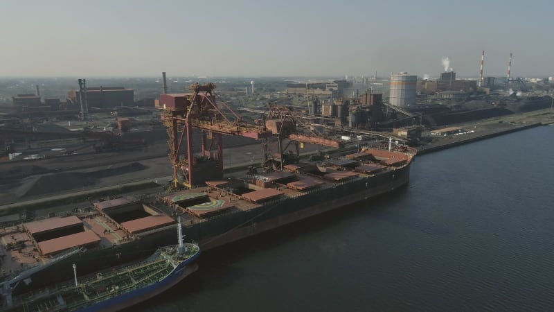 Ship Unloading Cargo at a Port for Processing at a Refinery