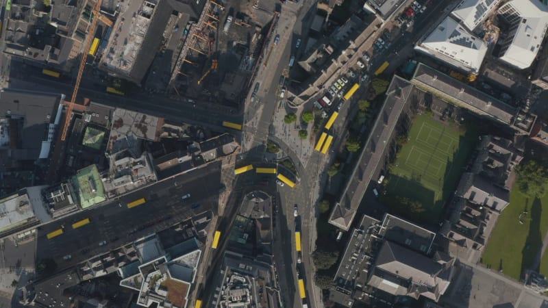 Aerial birds eye overhead top down view of yellow busses blocking streets during strike. Dublin, Ireland