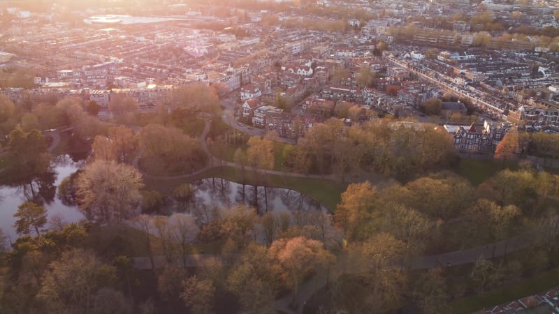 Aerial drone footage slowly orbiting the Wilhelminipark in Utrecht, Netherlands