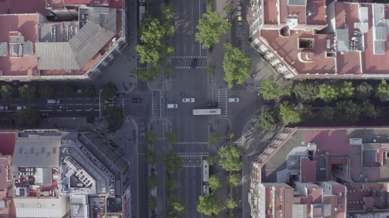 Time Lapse Aerial of Barcelona City Streets With Vehicles Amongst Buildings