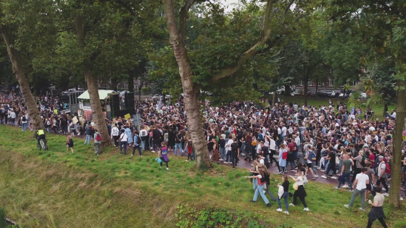 Protesters marching down a street during Unmute Us Campaign in Utrecht, Netherlands.