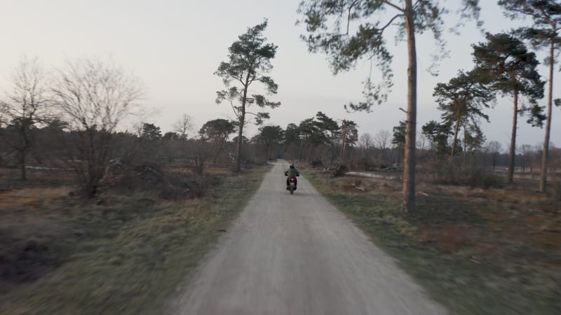 Aerial view of a bike riding a sand lane, Netherlands.