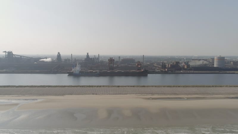 Bulk Carrier Ship Offloading Cargo at an Industrial Port in Europe