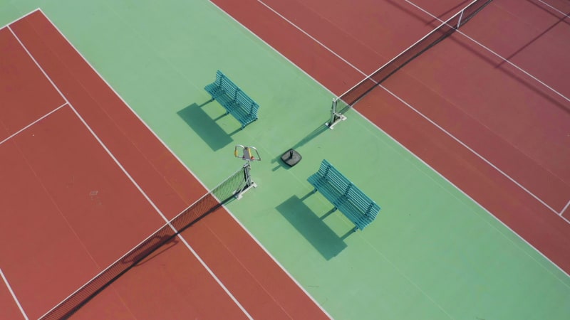 Aerial view of the wooden benches on a tennis court