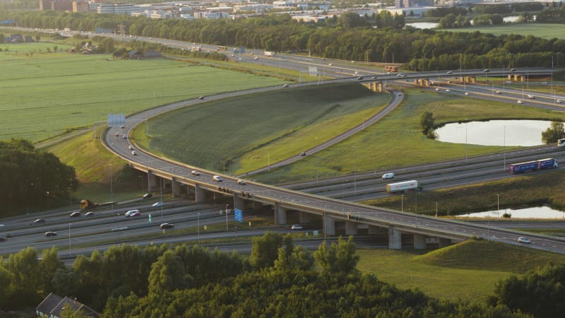 Busy highway traffic intersection next to the city