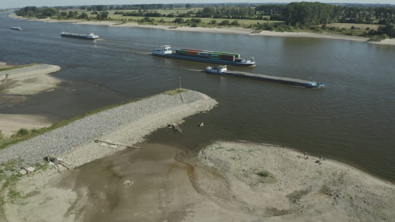 Cargo Ships Navigating River Waal in Spijk, Netherlands