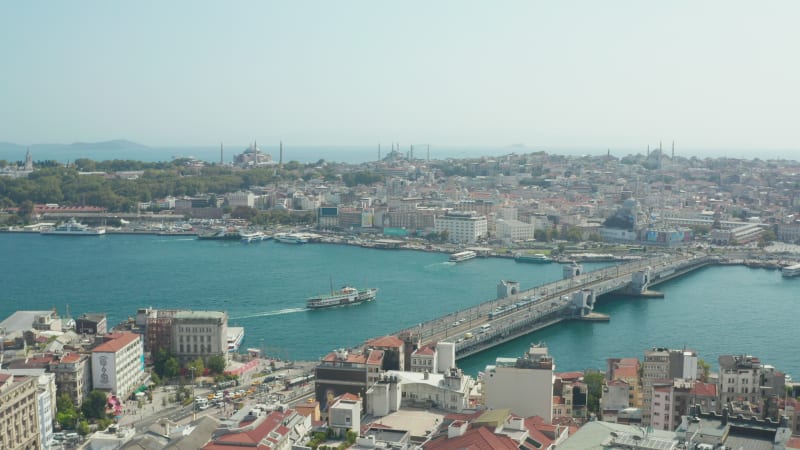 Galata Bridge with Public Transport Tram and Car traffic on a Beautiful clear Sky Day