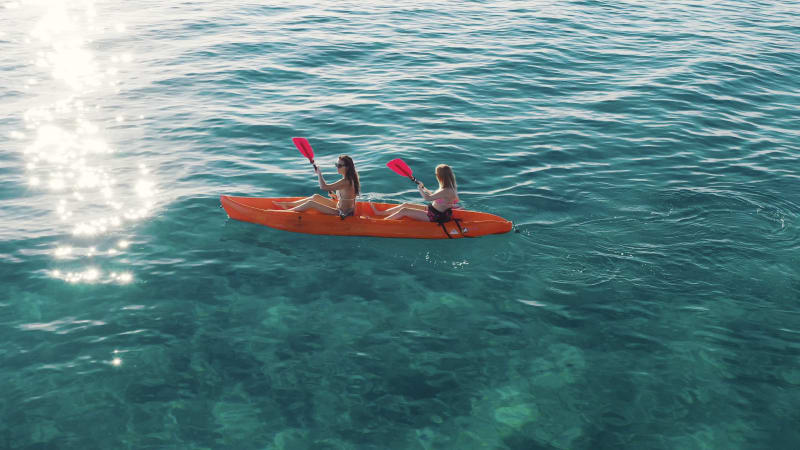 Aerial view of two women doing kayak in Montepaone, Calabria, Italy.