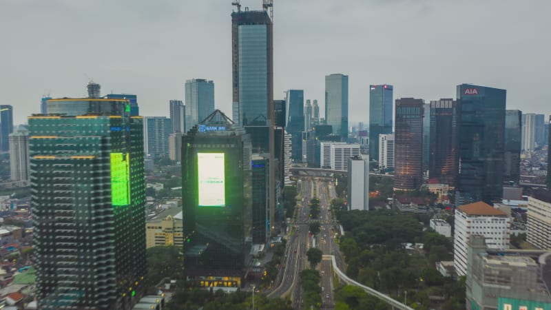 Aerial hyperlapse time lapse of a busy traffic in modern city center with skyscrapers towers and high rise buildings in Jakarta, Indonesia, Motion Time Lapse Hyper Lapse