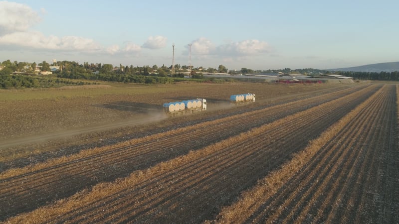 Aerial view of lorries in a cotton field, Israel.