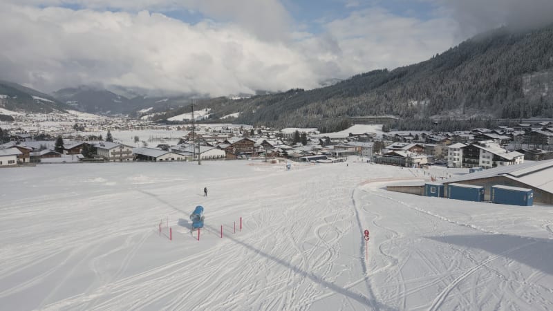 Skiers Entering Flachau Village, Austria