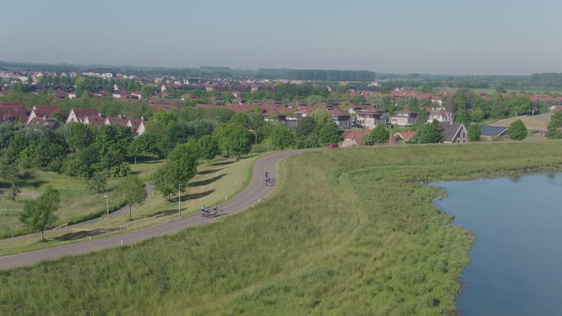 Cycling Team On Dike Road in Culemborg