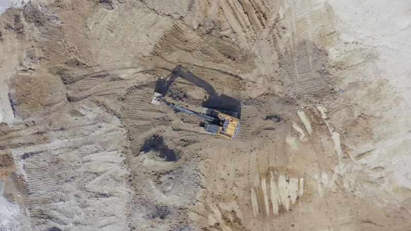 Groundworks Digger Moving Earth During Construction