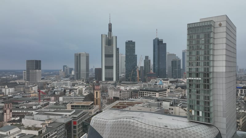 Fly around shopping centre MyZeil in urban neighbourhood. Modern office towers in business borough in background. Frankfurt am Main, Germany