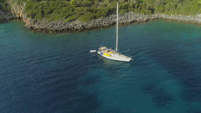 Aerial view of sailboat anchored in the mediterranean sea, Nisi.