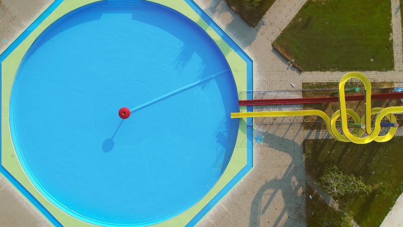 Aerial view of empty pool with slides in abandoned aqua park.