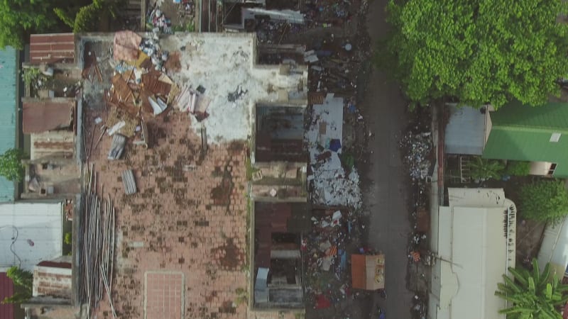 Aerial view above of a abandoned housing complex full of trash.