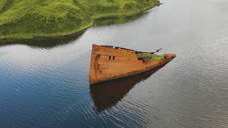 Aerial view of a shipwreck in Captain Bay in Unalaska, Alaska, United States.