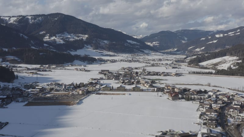 Aerial view of sunny snow covered alpine resort village of Flachau, Austria