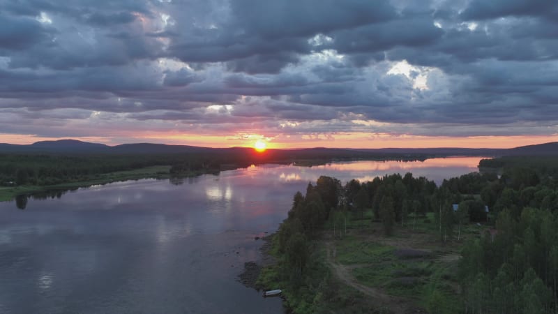 Aerial view of a lake at sunset in Overtornea, Sweden.