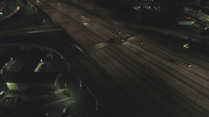 Aerial view of vehicles driving at night on Los Angeles highway, United States.