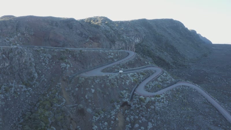 Aerial view of a vehicle driving a twisty road, Reunion.