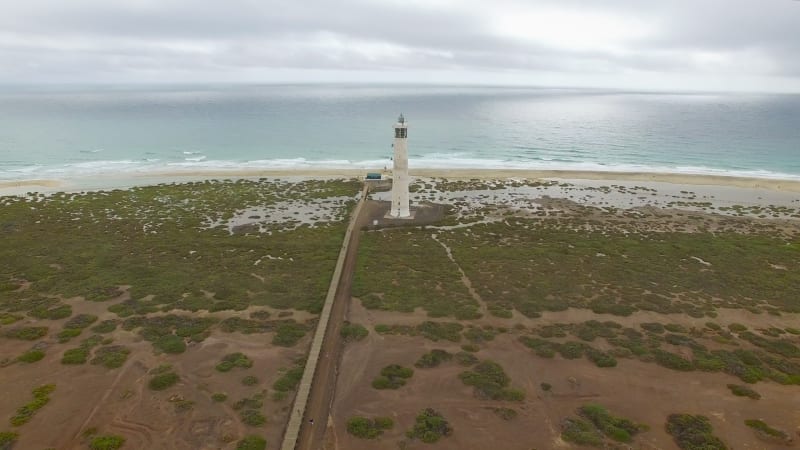 Aerial view of Morro Jable Lighthouse with cloudy weather.