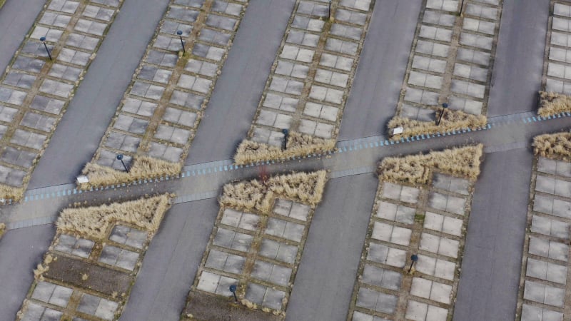 Aerial view of overgrown empty parking lot